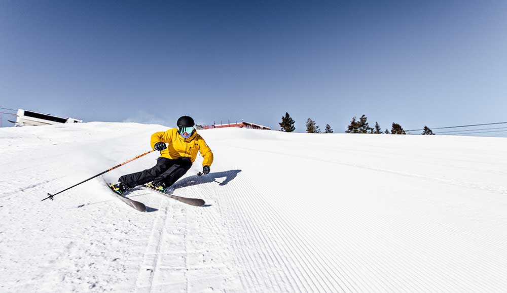 A skier carves turns on a groomer at Sun Valley