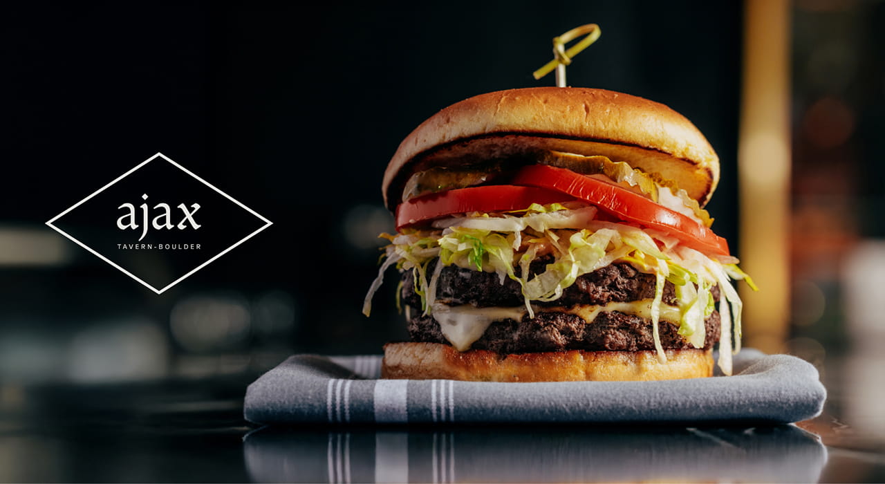 image of cheeseburger with Ajax logo