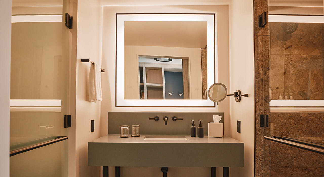 bathroom vanity and shower in guest room