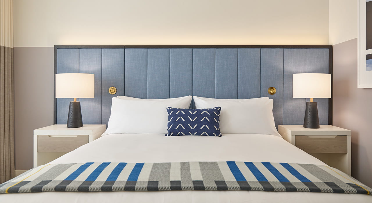 bed and night stands in guest room