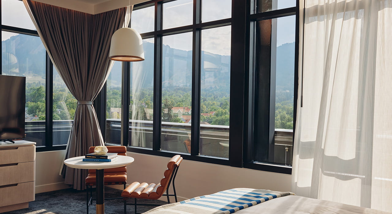 table and chairs by windows