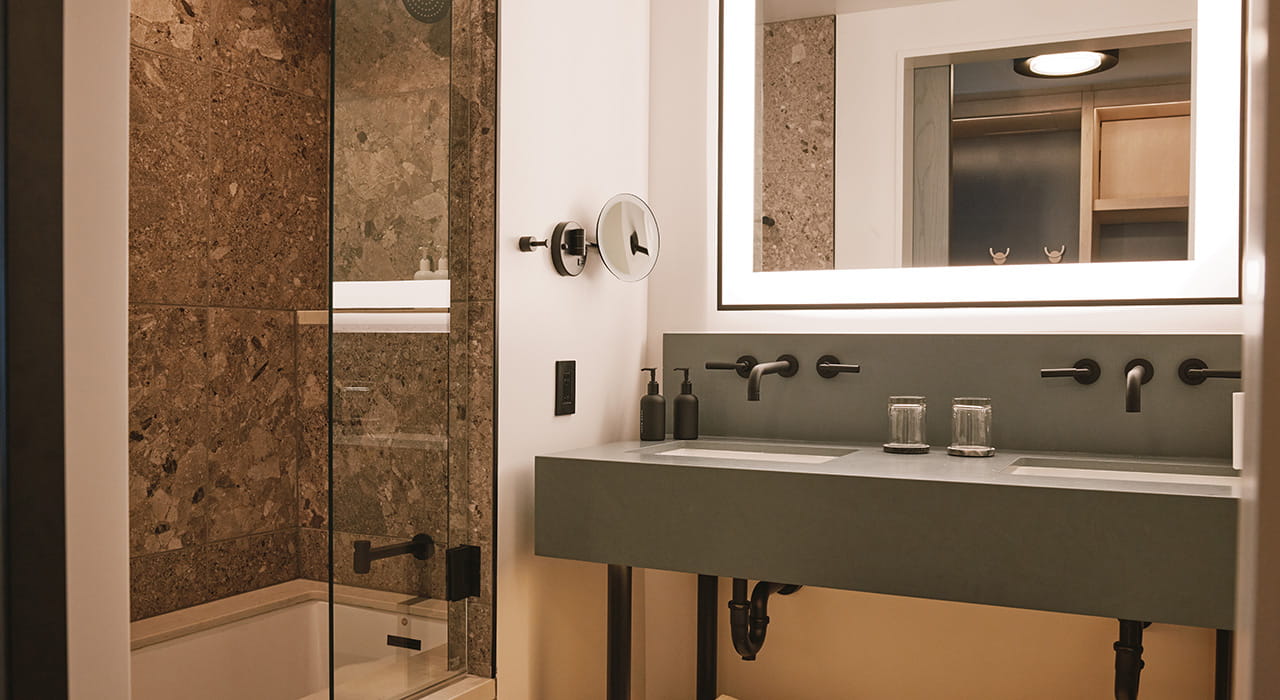 bathroom vanity and tub in guest room