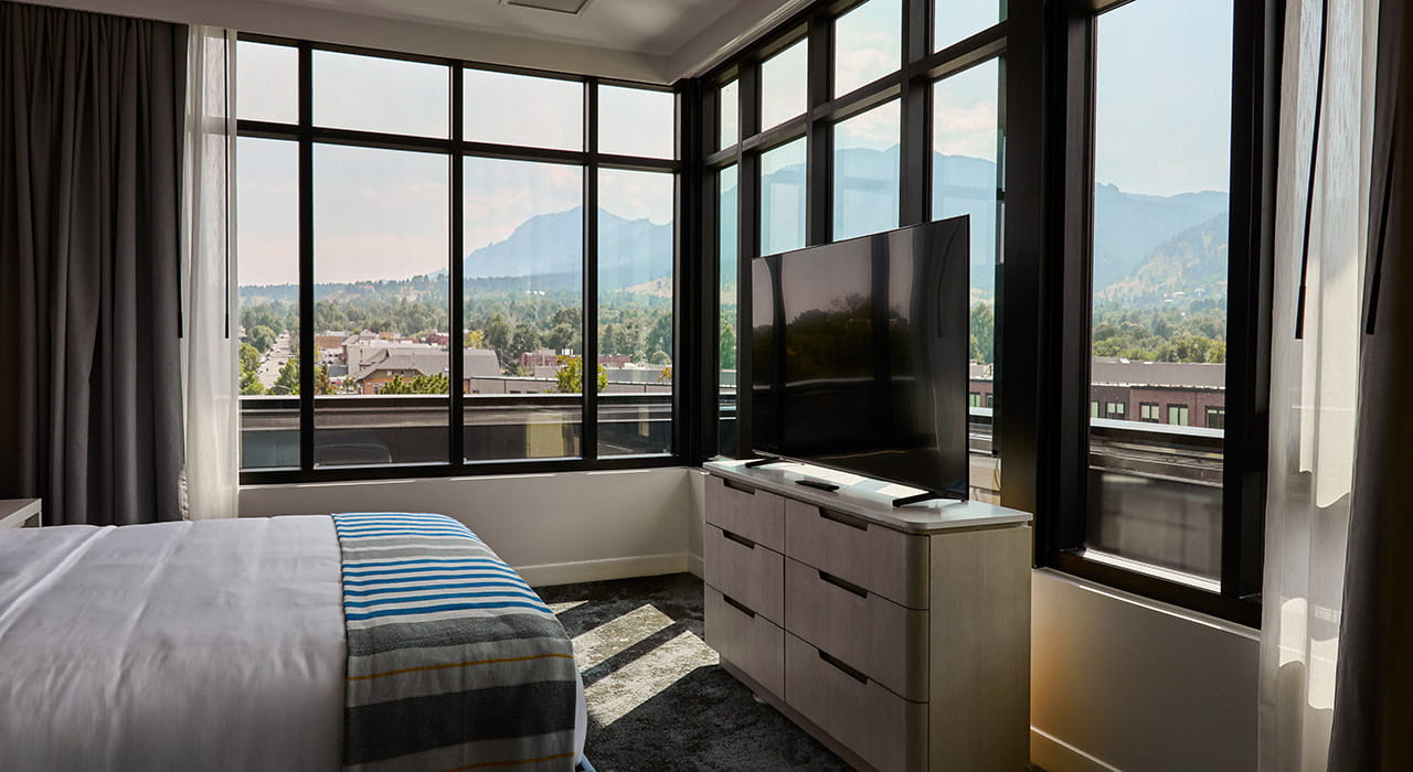 king bed and tv in limelight suite