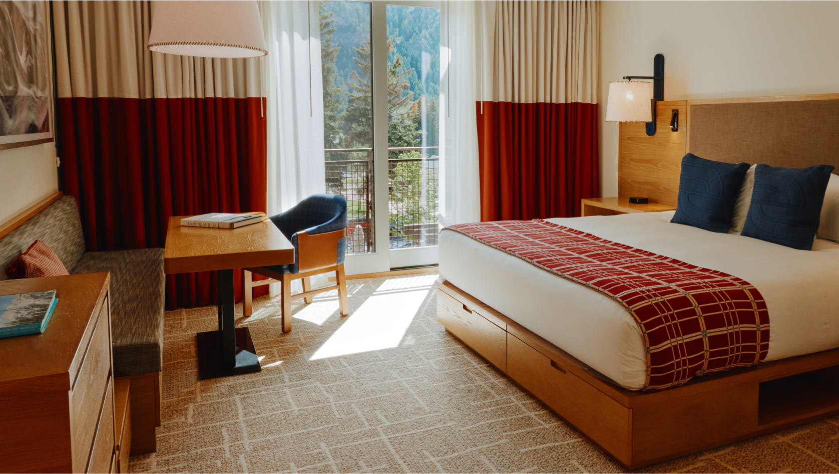 bed and desk in deluxe guest room