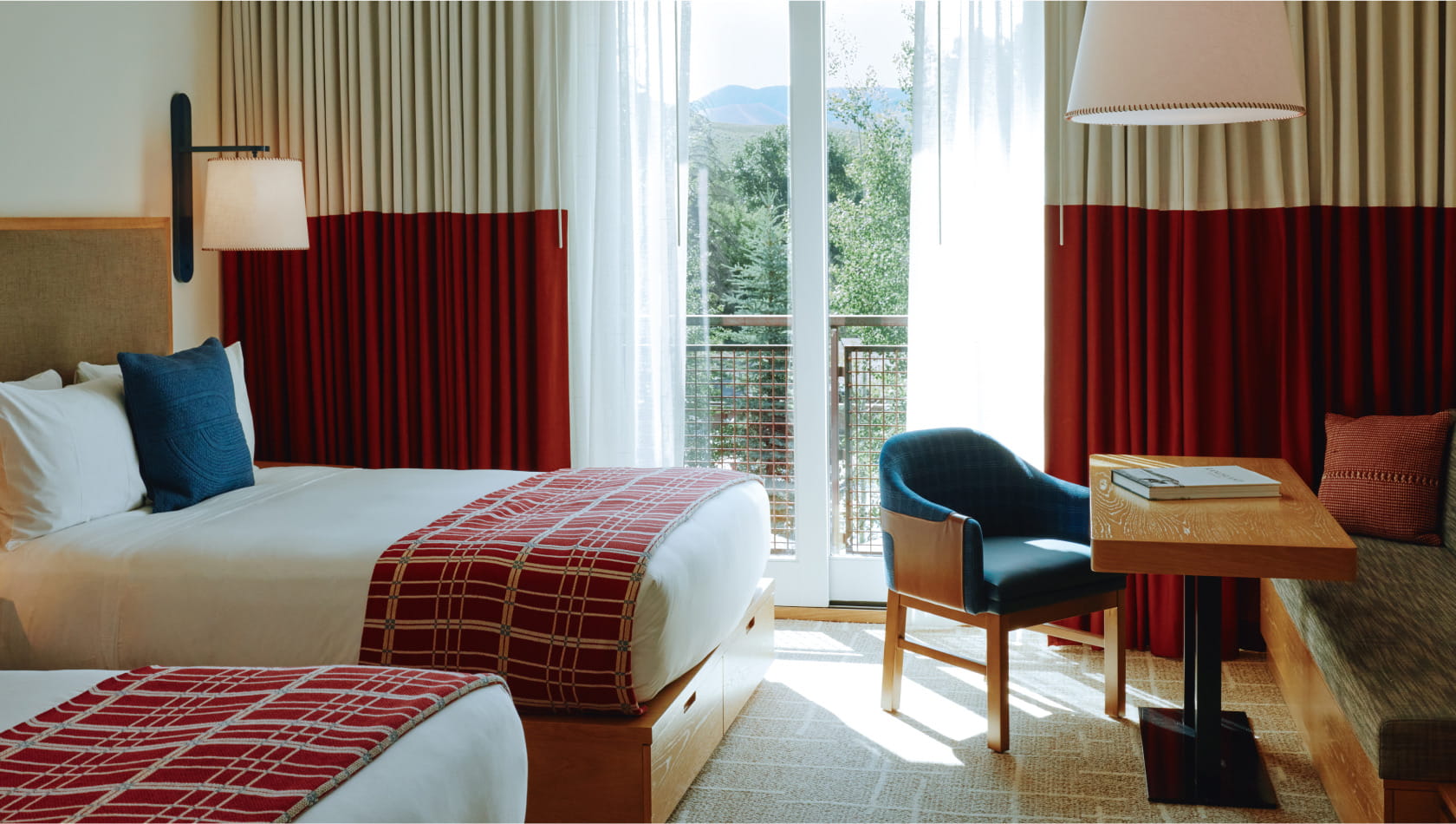 two queen beds and table in grand deluxe room