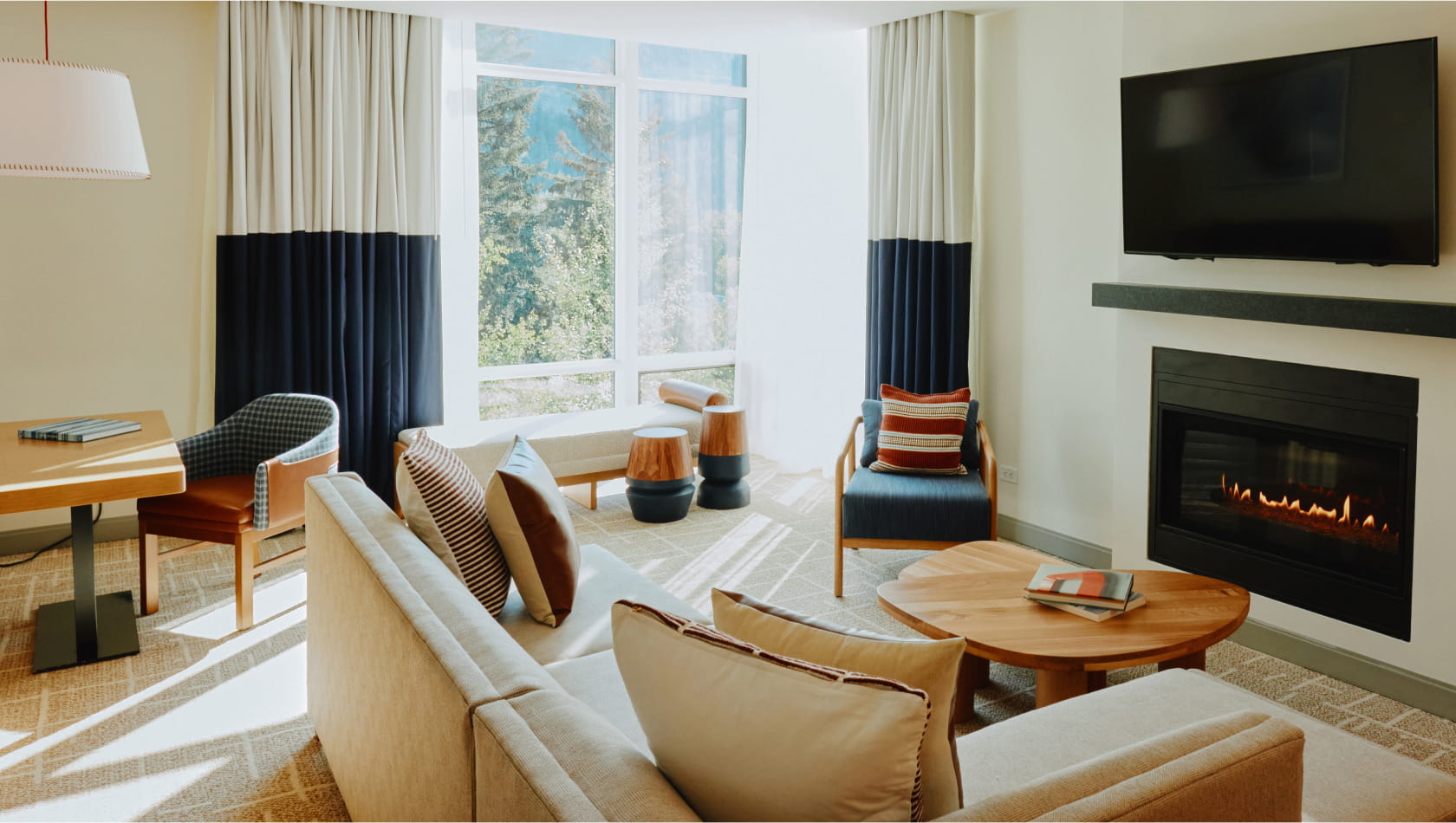 living room with fireplace in suite