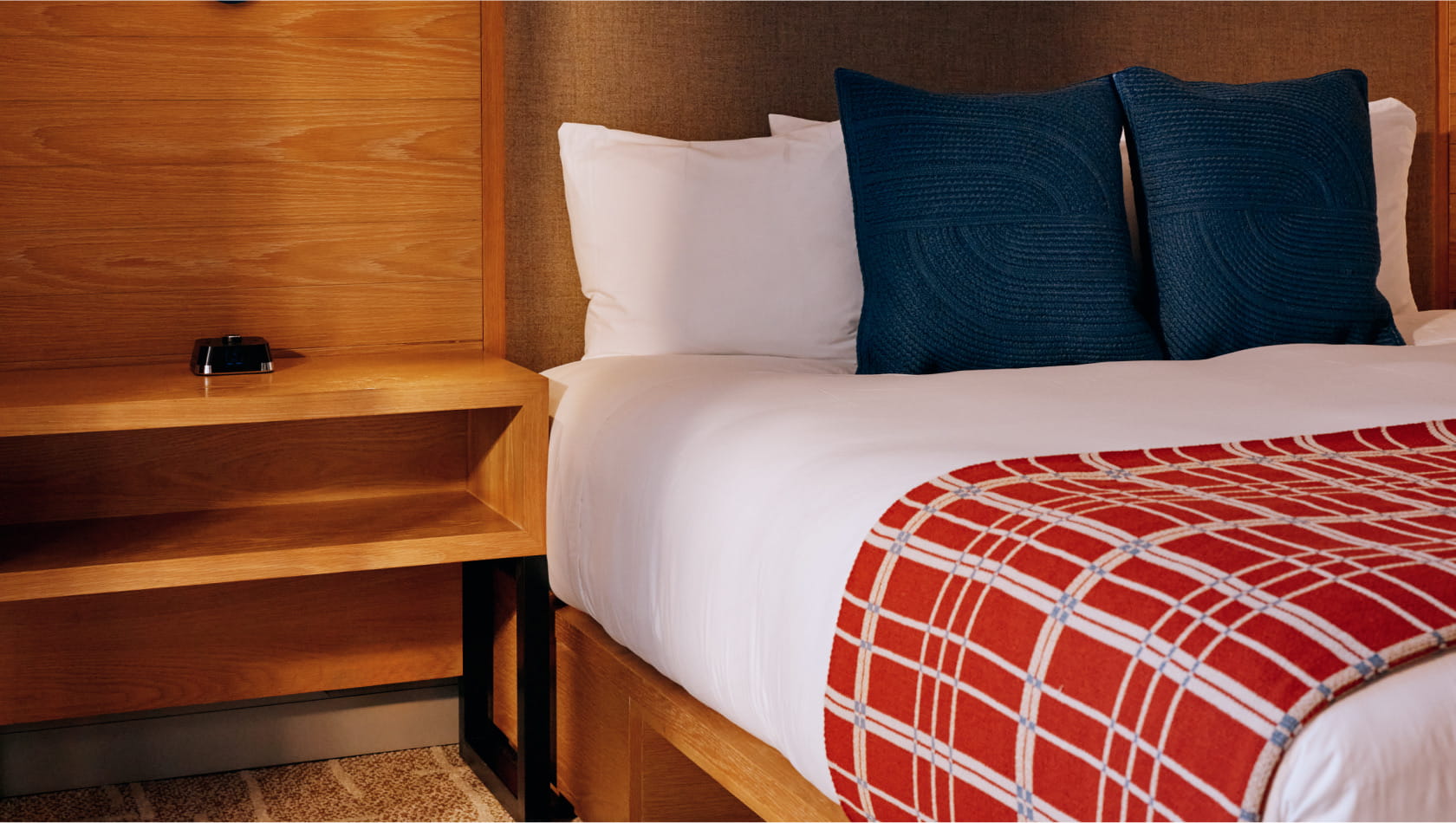 bed and night stand in guestroom