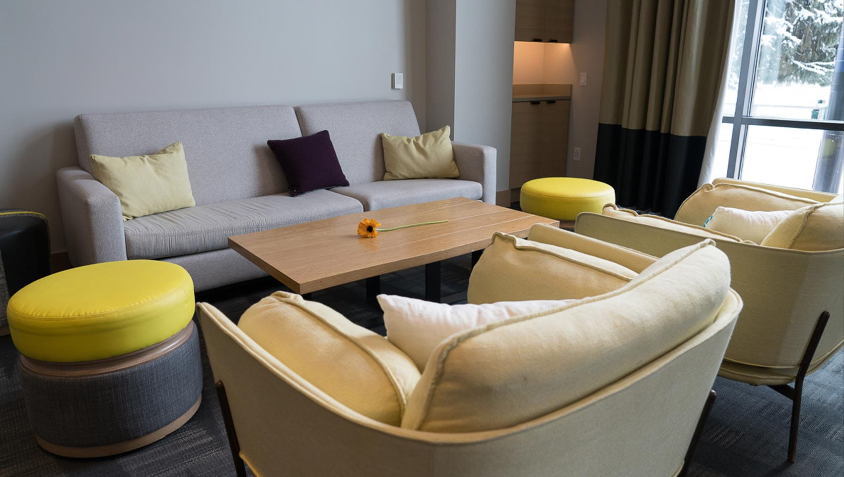 A modern lounging area with couches and seats for guests at Limelight Hotel in Ketchum, Idaho.