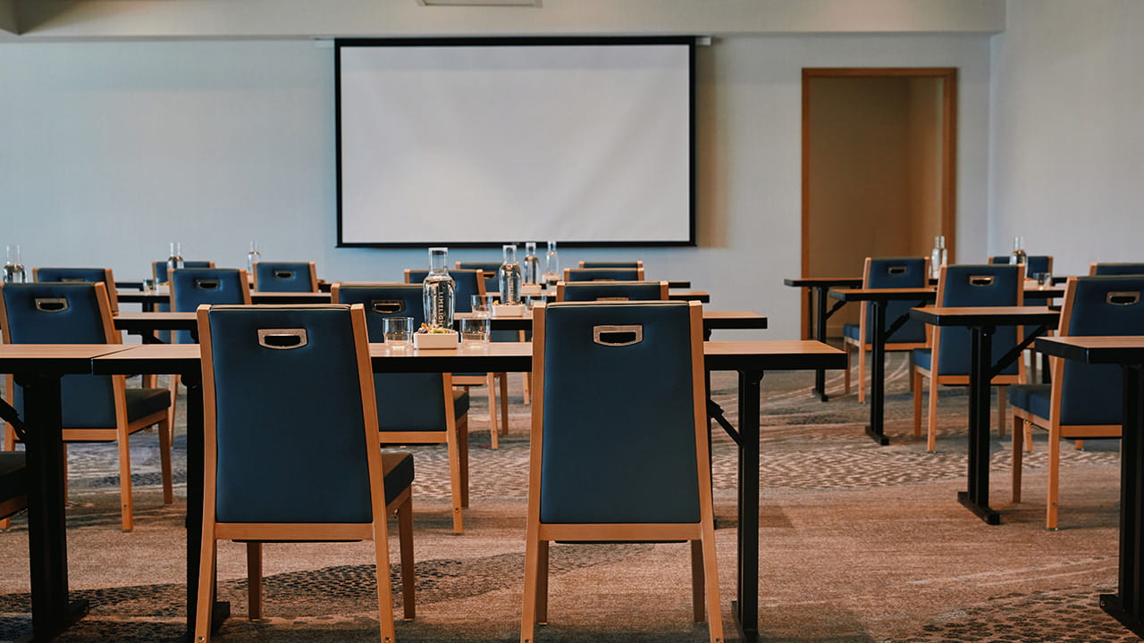 ballroom venue set up classroom style with projector