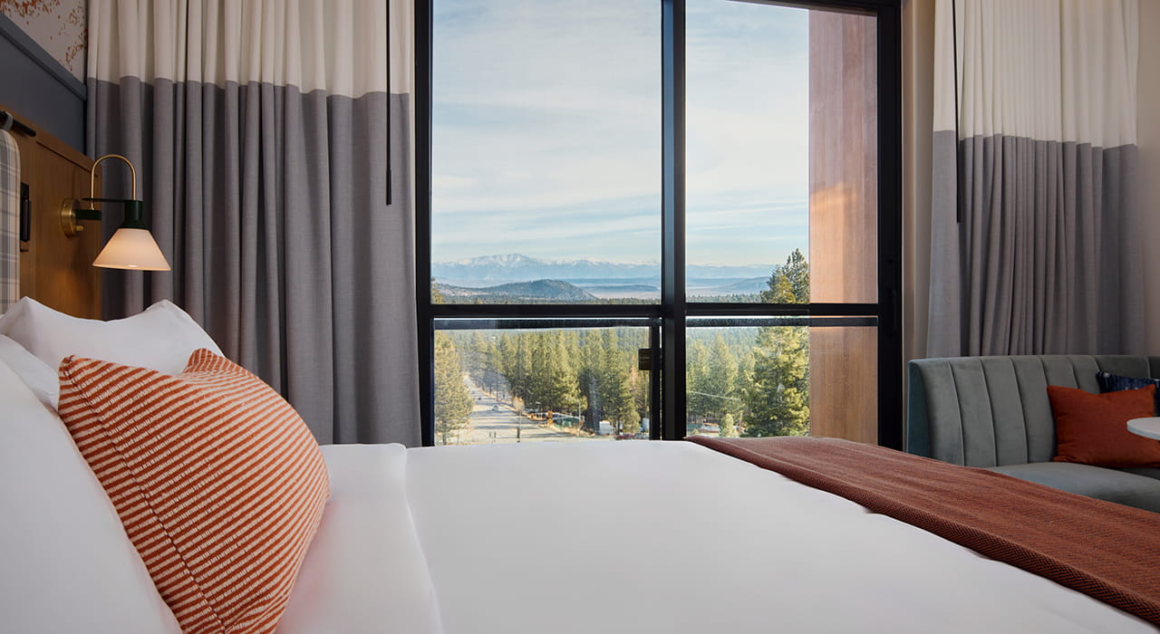 king bed overlooking mountains