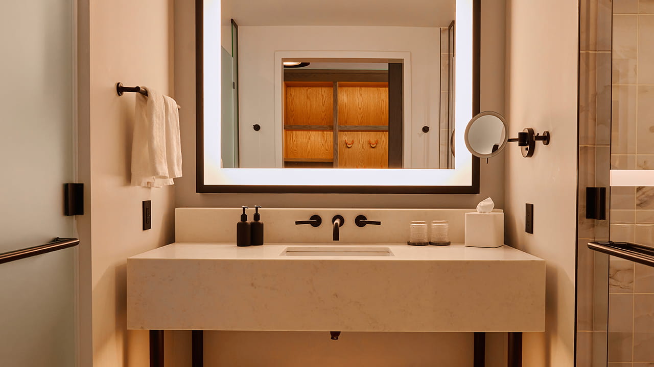 bathroom vanity and shower in guest room