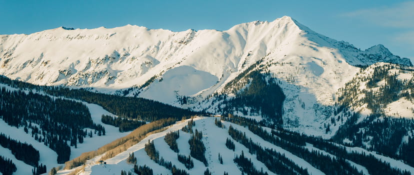 aerial view of snowmass mountain in the winter