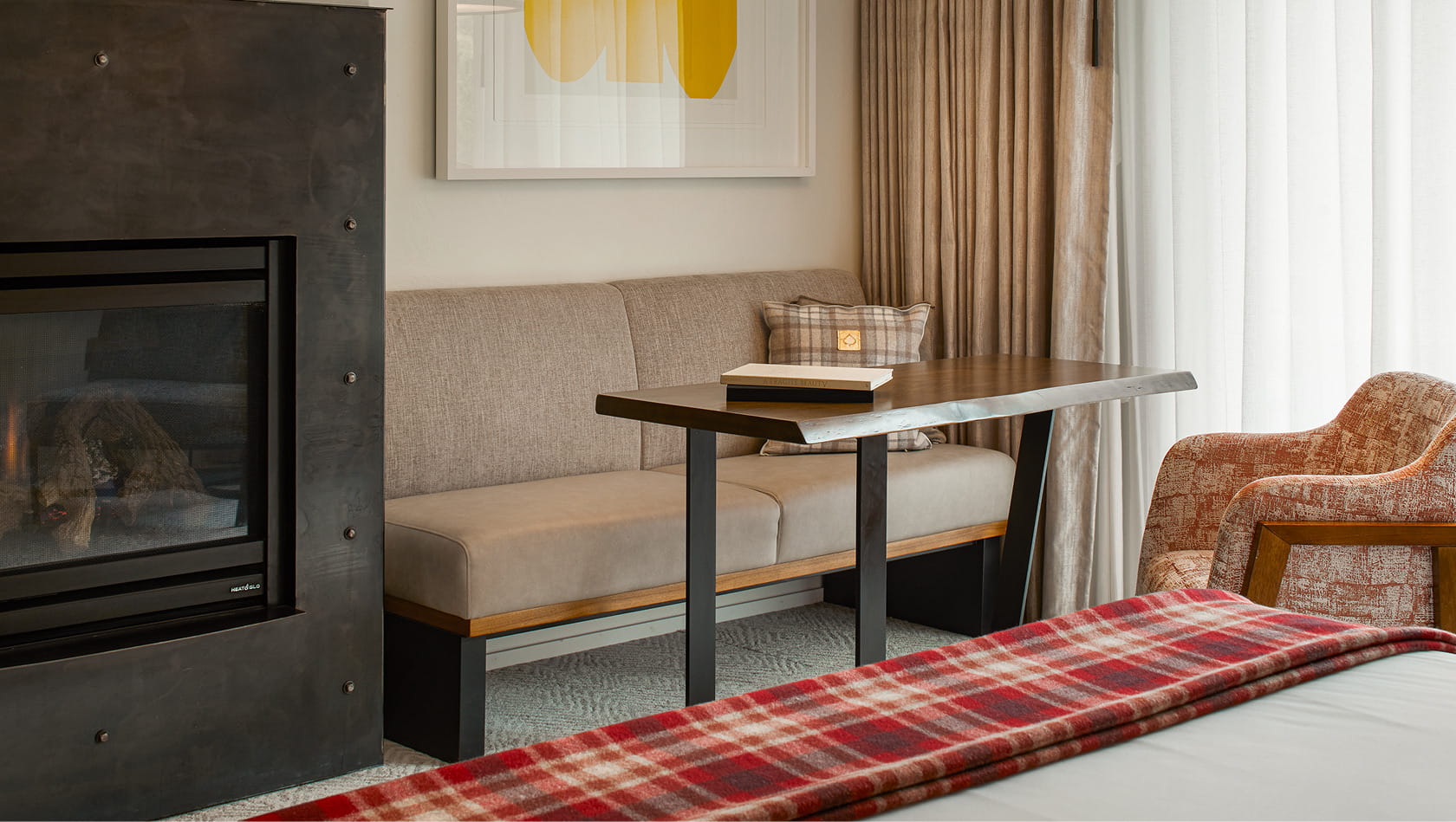 seating area by fireplace in guest room