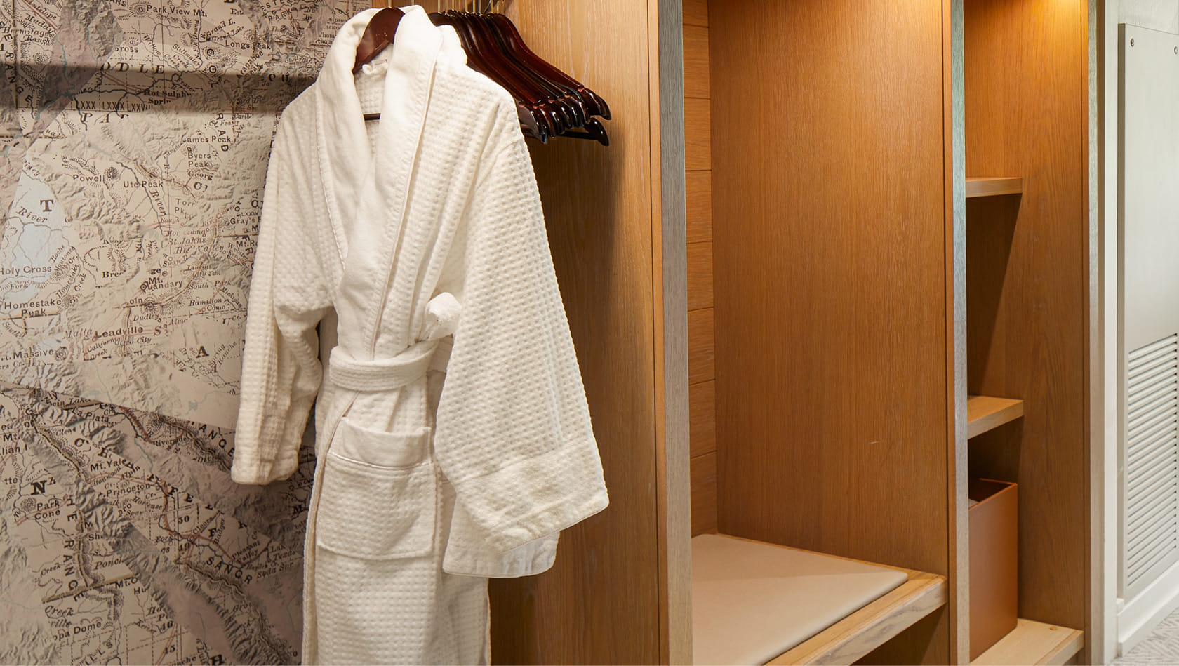 robe hanging in cubby storage area