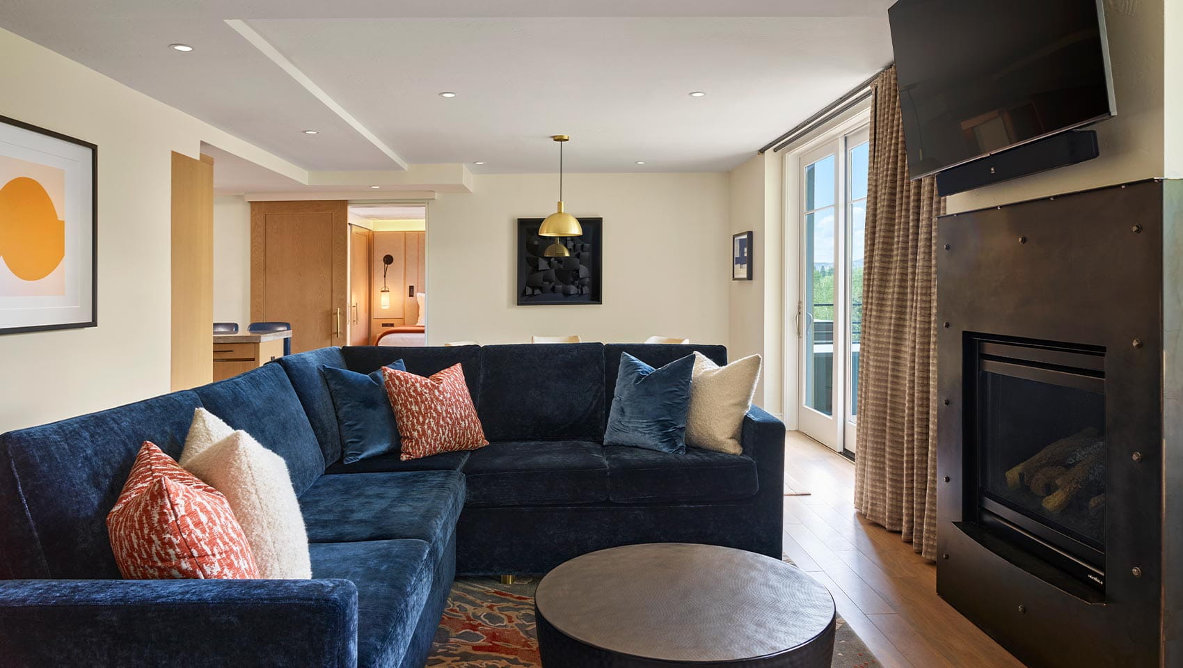Couch by fireplace in Penthouse Suite in Aspen