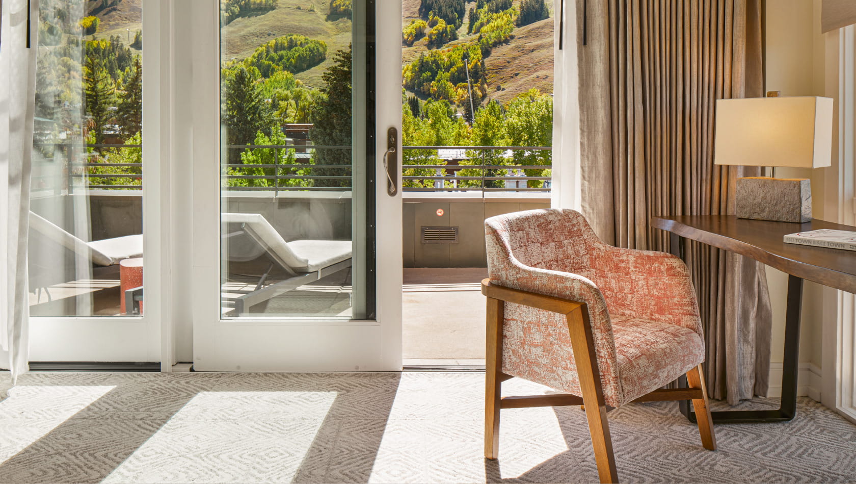 chair near terrace overlooking mountains