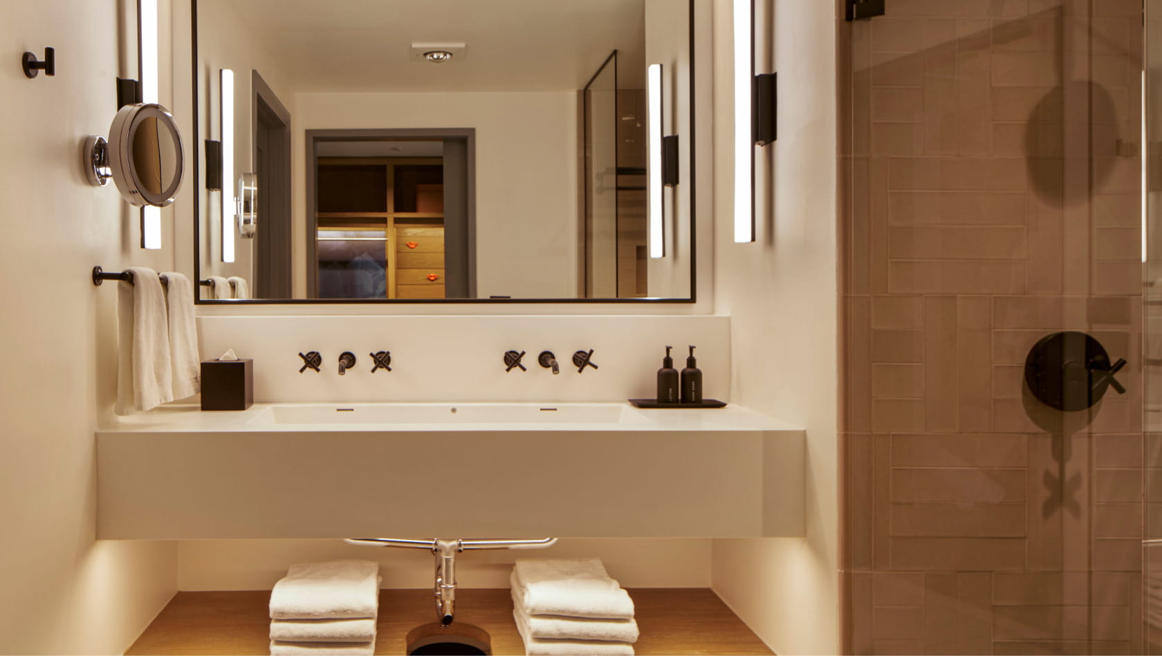 bathroom vanity and shower in guest room