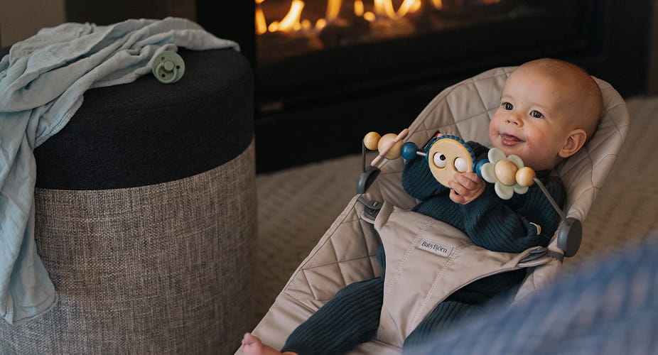 baby in bouncer chair