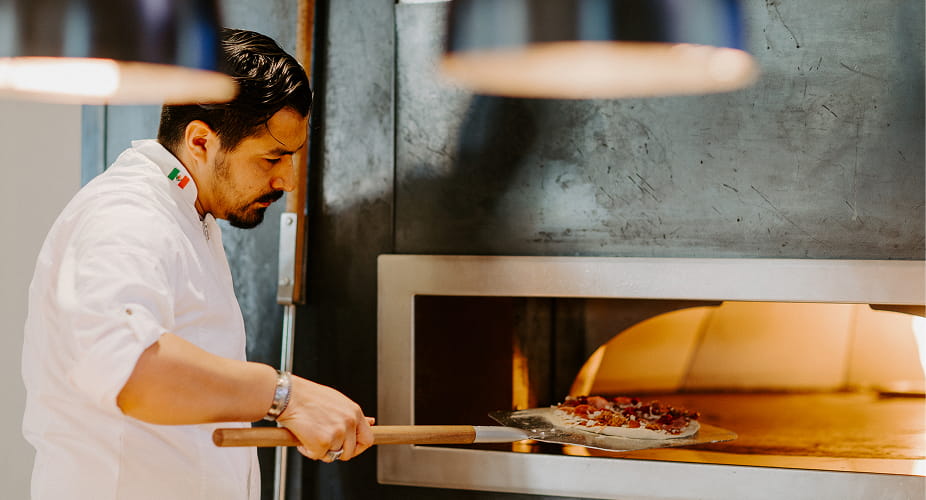 chef using pizza oven