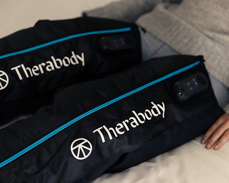 person using JetBoots on bed