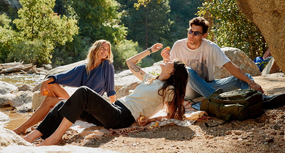 friends hanging by creek
