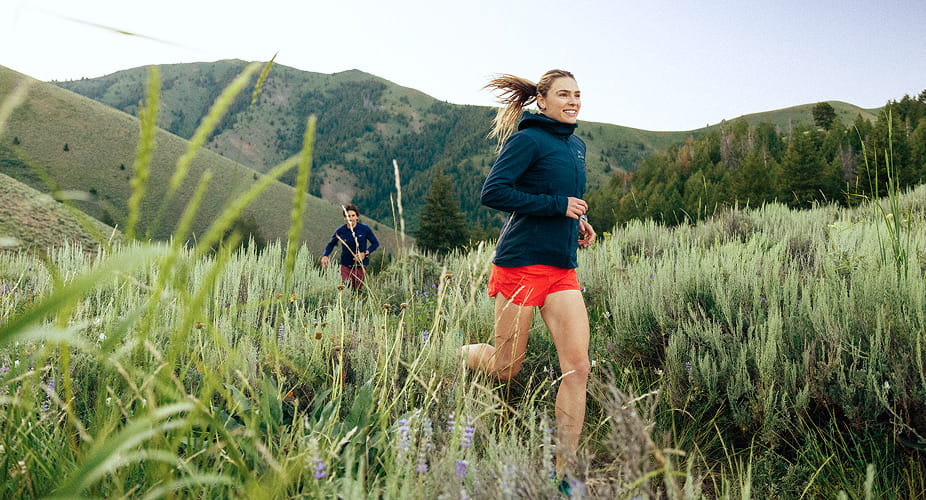runners trail running through mountains