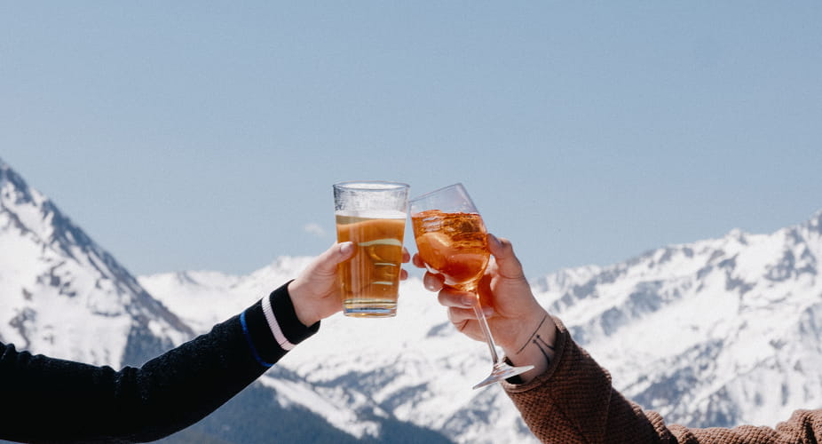 two people cheerings on mountaintop