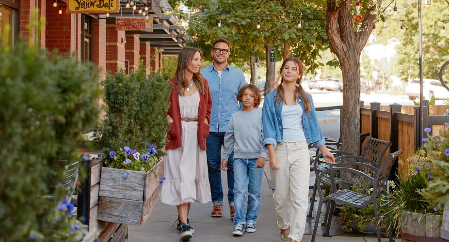 family walking on pearl st in boulder