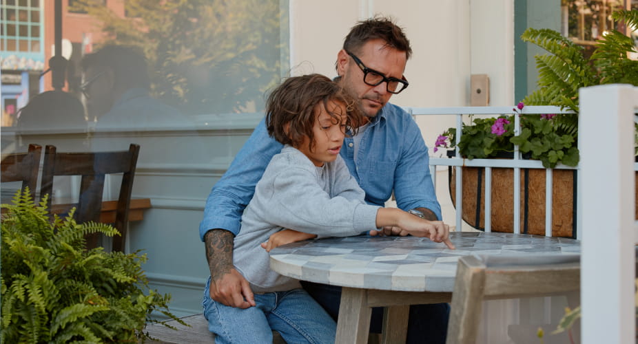 dad with son at table
