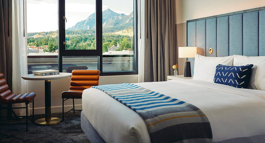 bed in guestroom at limelight boulder