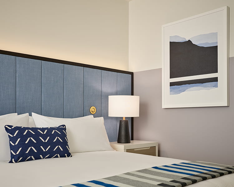 bed and art in guest room