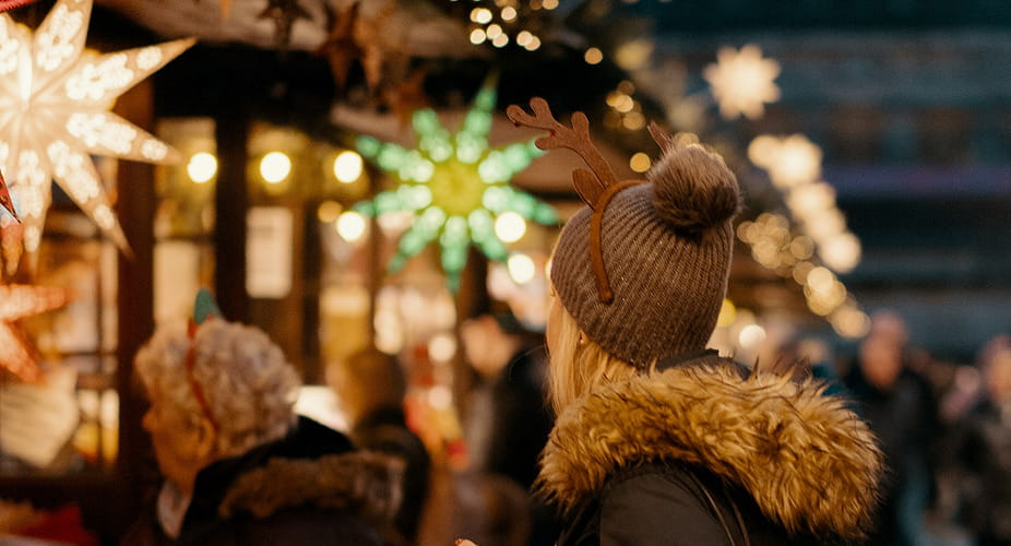 woman standing at holiday market