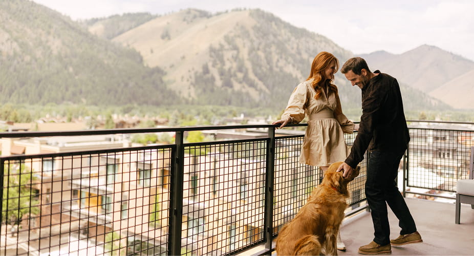 couple on limelight ketchum balcony with dog