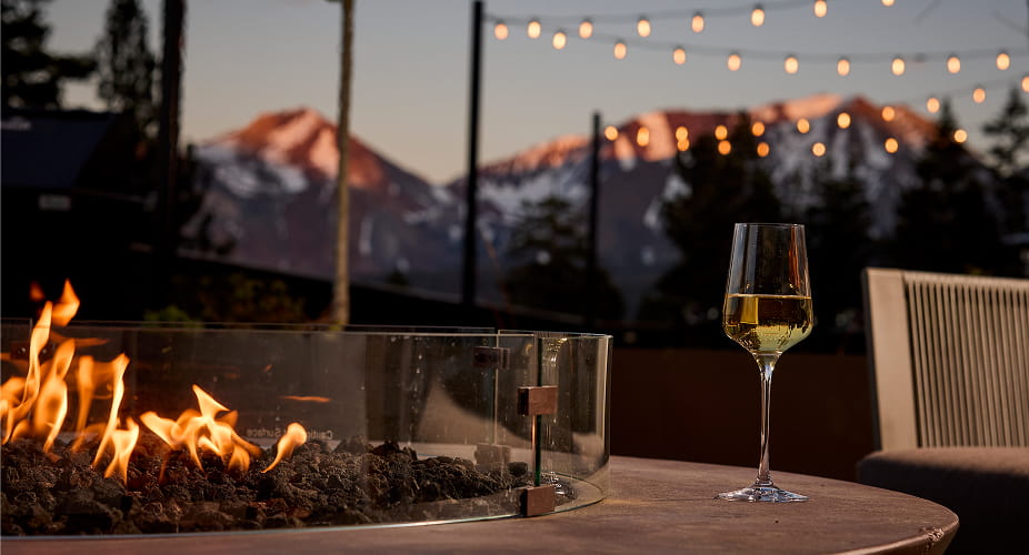 wine glass on firepit outside at hotel