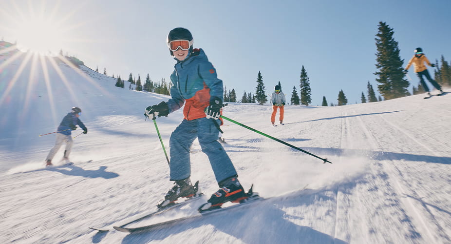 kid skiing on snowmass mountain