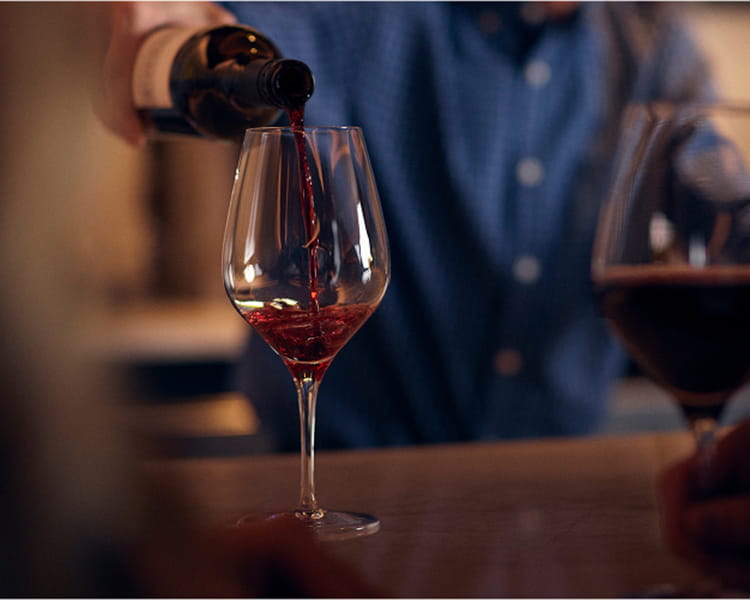 glass of wine being poured