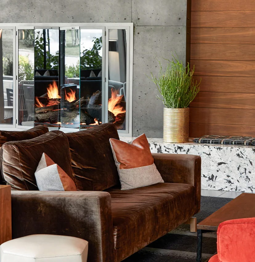couch by fireplace in the lounge