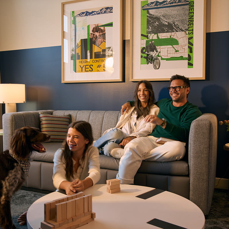 family together in suite living room