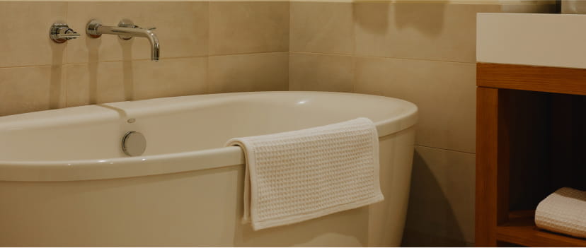 soaking tub in suite bathroom