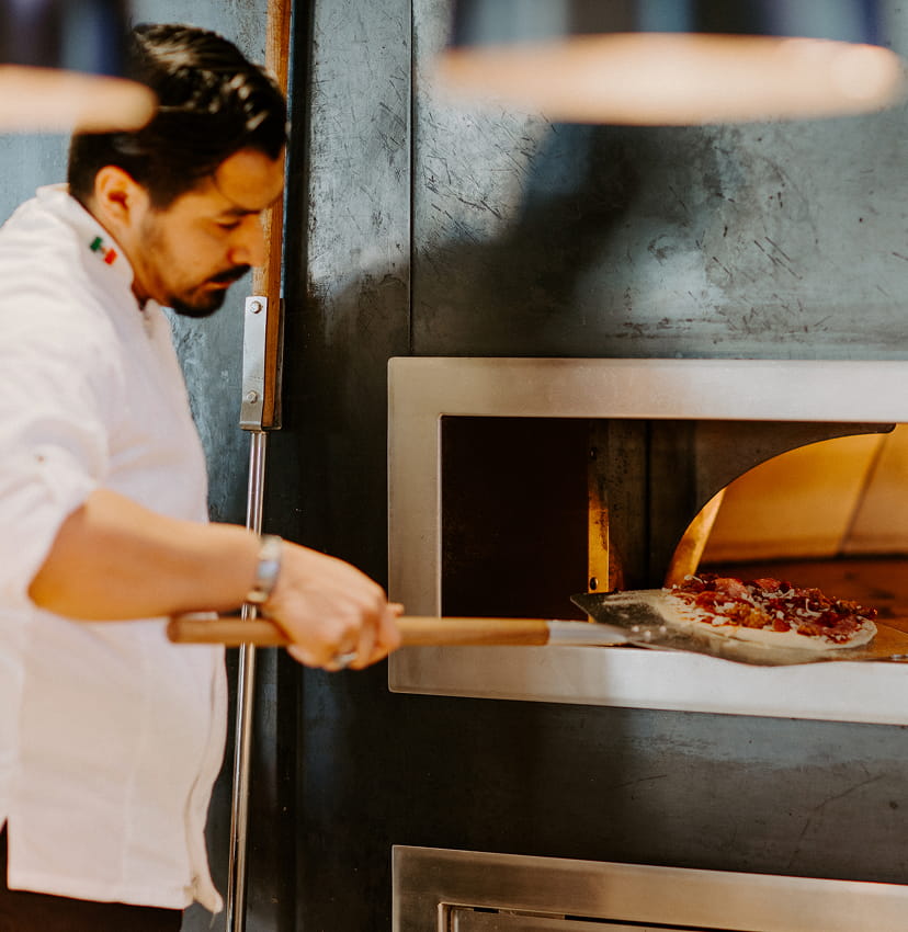 chef using pizza oven