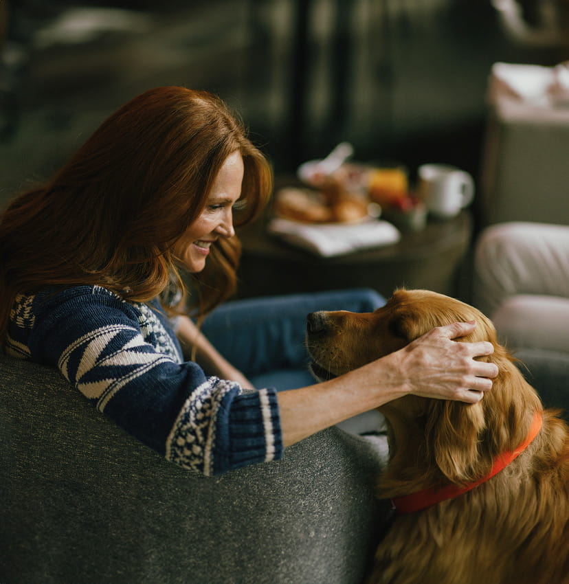 woman with dog in lobby