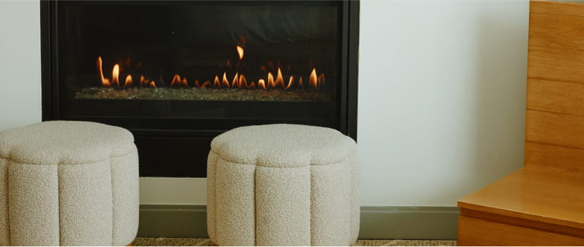 ottomans by fireplace