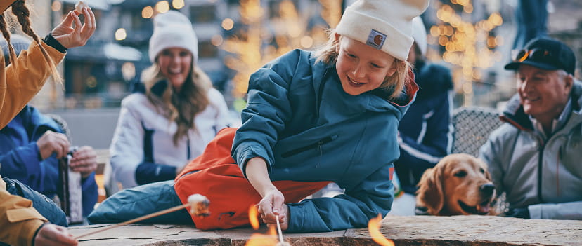 kid roasting marshmellow outside of limelight snowmass