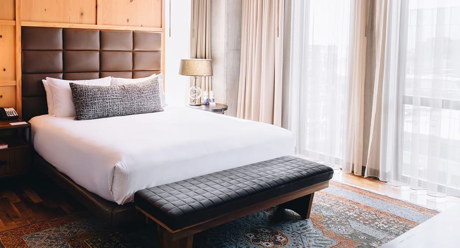 bed in guestroom at limelight denver