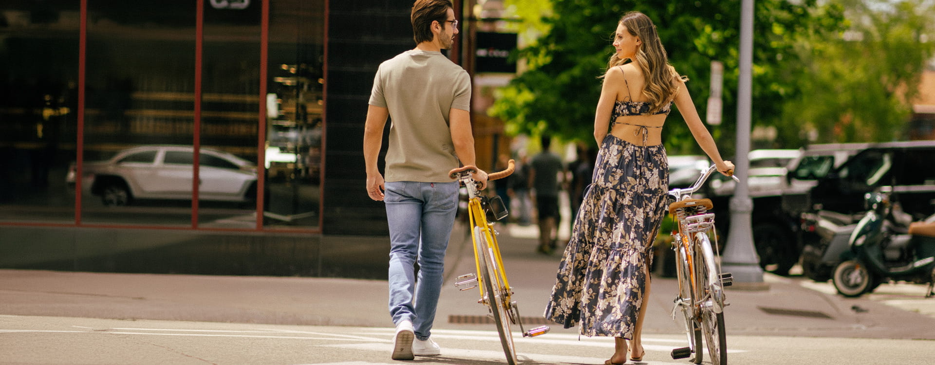 couple walking with bikes