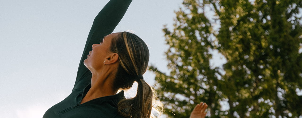 woman doing yoga outside