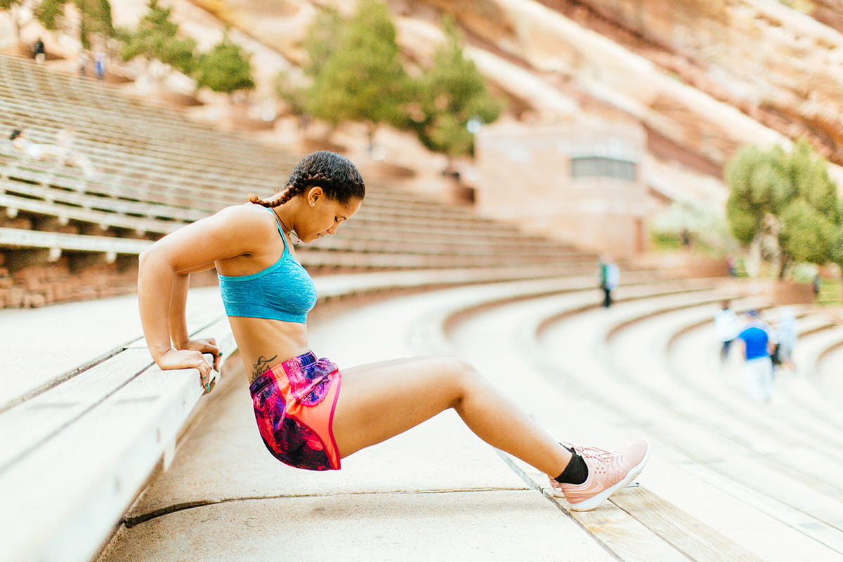 Woman working out on the steps of the Red Rocks Ampitheatre