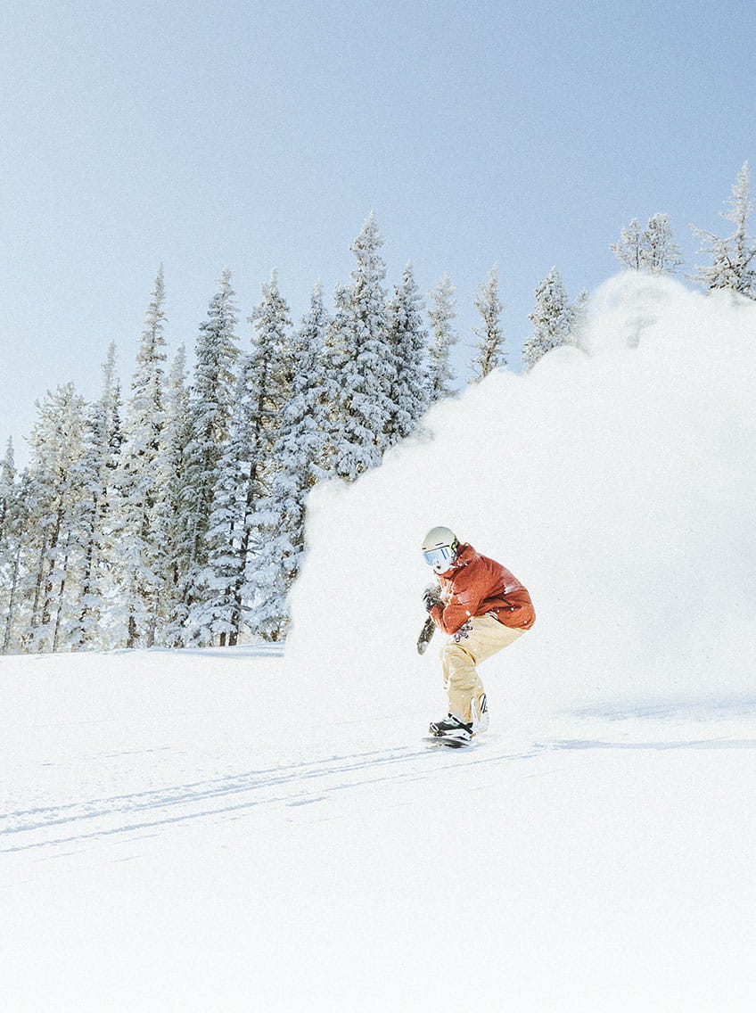 snowboarder skiing powder