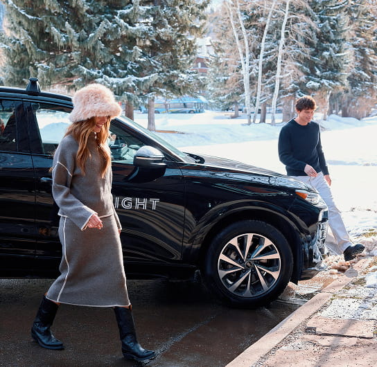 couple getting out of audi car