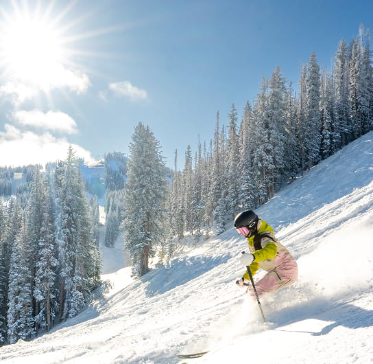 person skiing powder